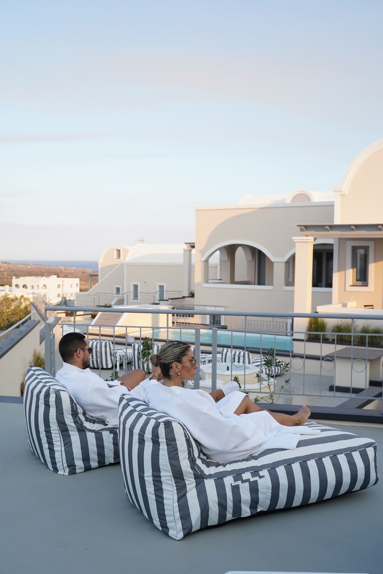 Pool and lounge area at The Noverian Bios Caldera